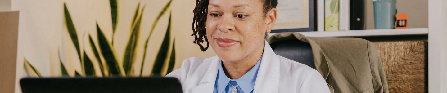 Doctor behind screen in office