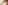 Close-up of a woman's tanned shoulder
