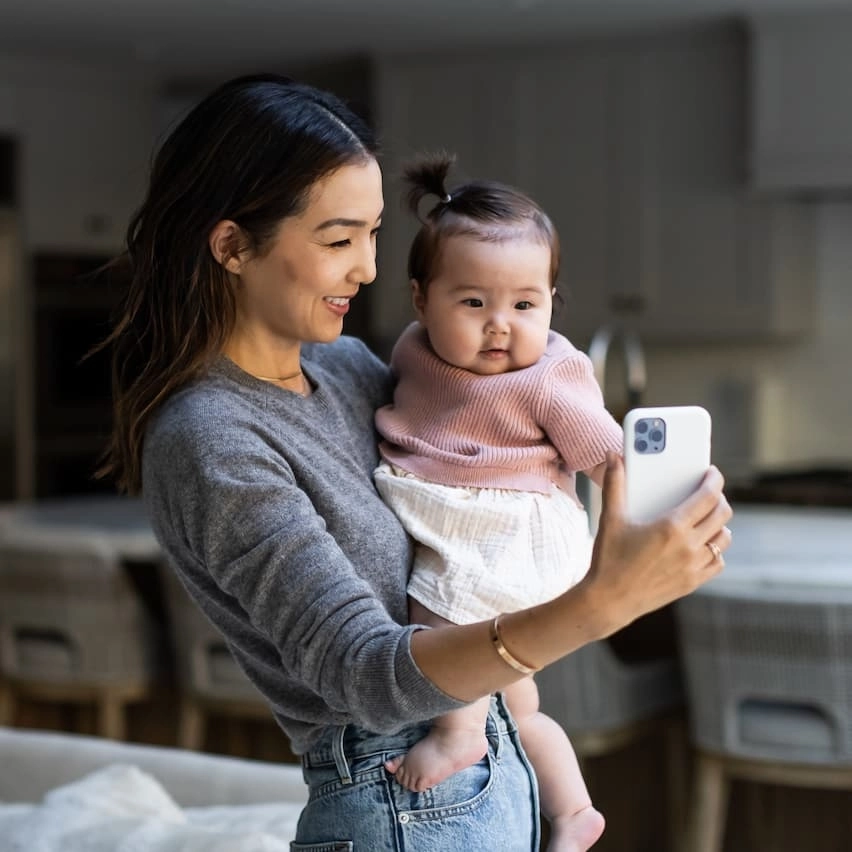 Mom and baby having telehealth appointment
