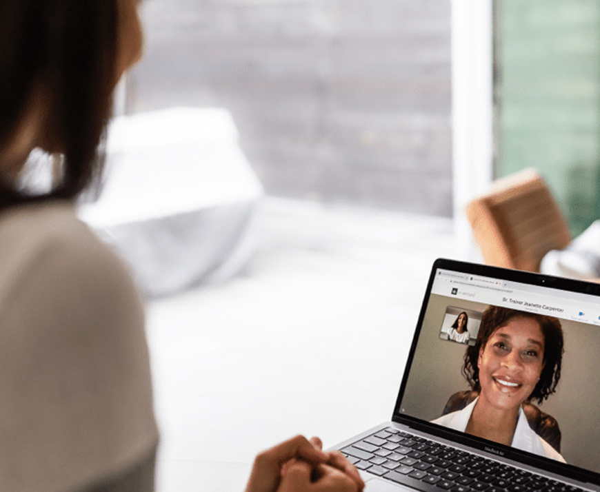 Woman having a telemedicine appointment on her laptop