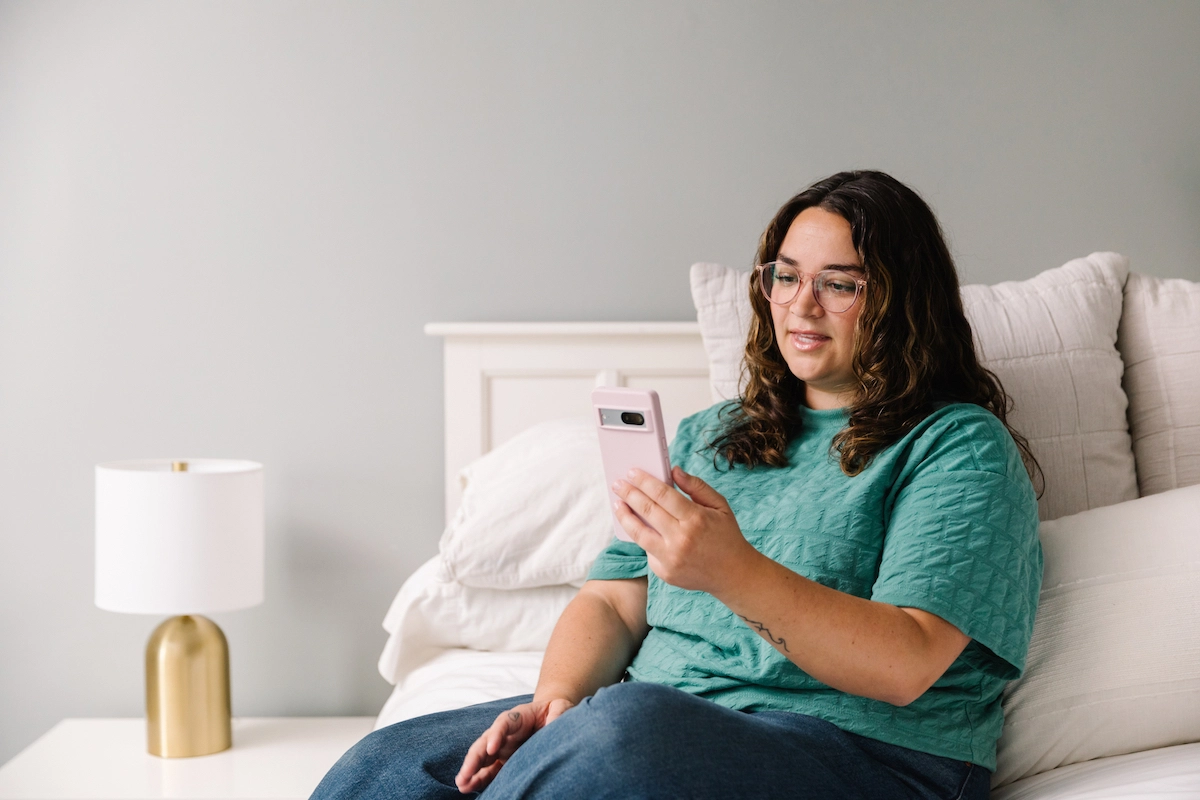 Doctor On Demand patient taking virtual care session from bedroom