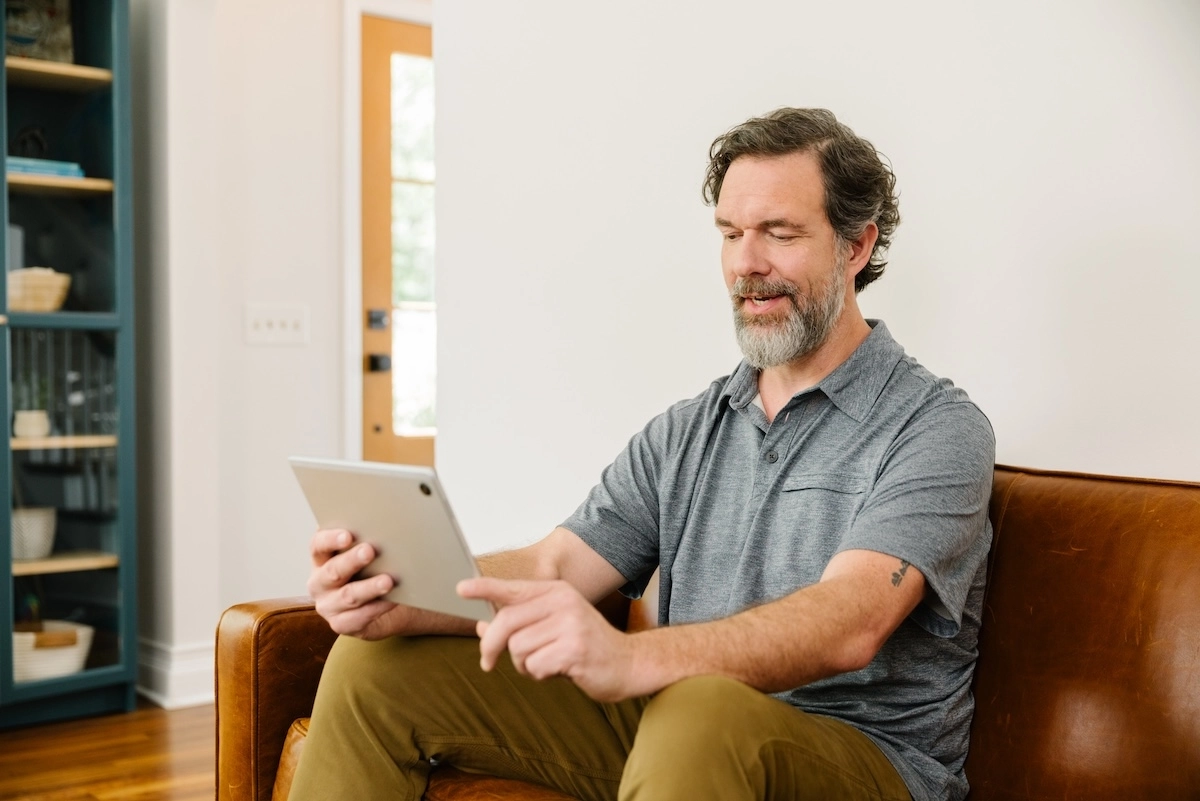 man using telehealth VPC on his ipad