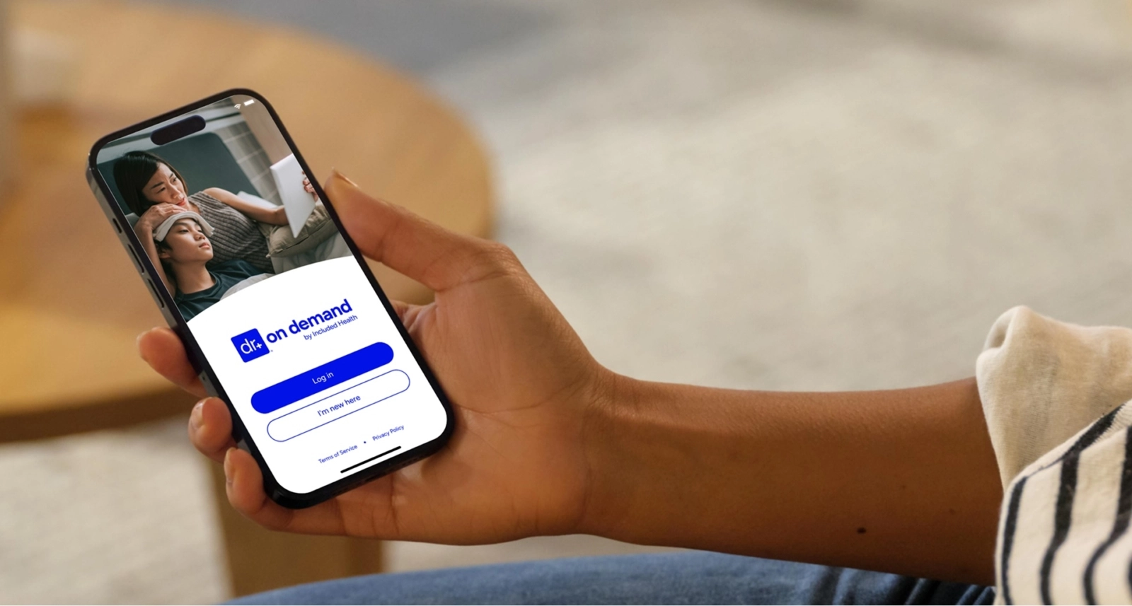 person holding phone with Doctor On Demand app open