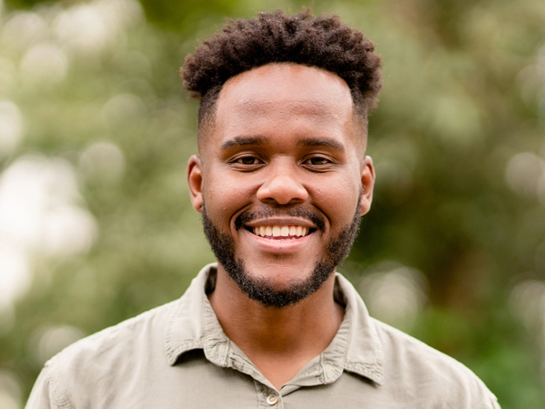 younger man smiling