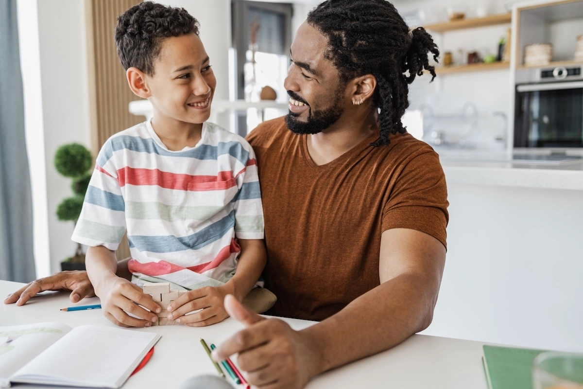 Dad and son playing a game together.