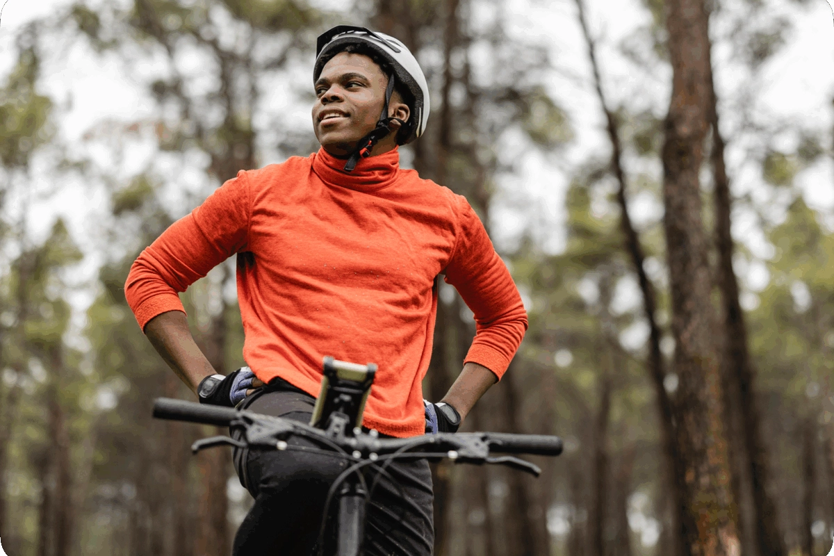 A man out for a bike ride in a forest