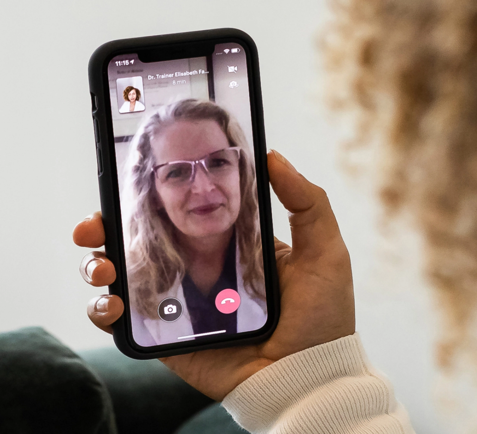 A woman speaking with her doctor via a video call.