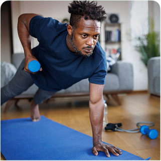 Older man exercising at home